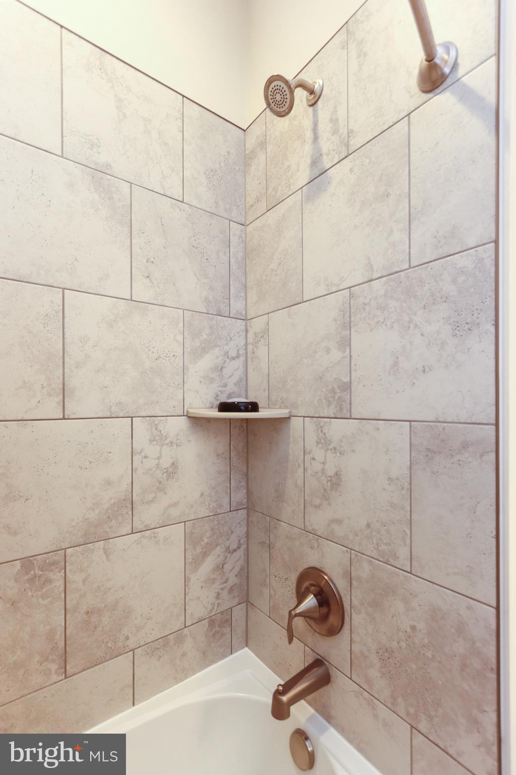 7146 Proclamation Place Frederick, MD 21703 - Photo 42 of 54 HALL BATH CUSTOM TILE PACKAGE