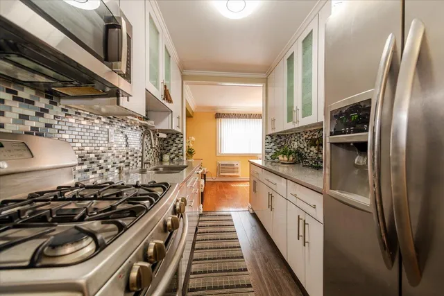 a kitchen with a stove and a refrigerator