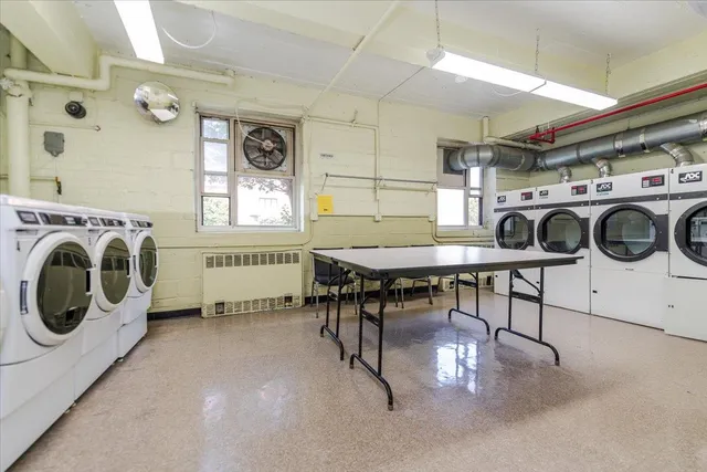 a view of a storage & utility room with washer and dryer