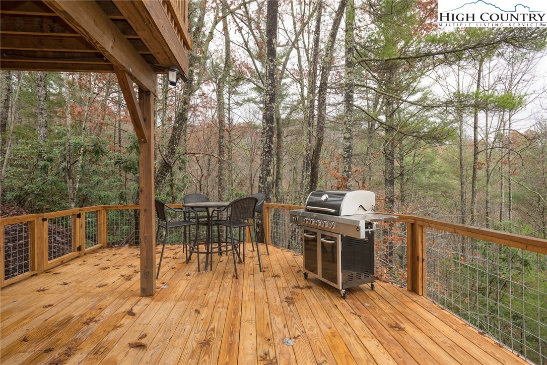 196 Wagon Ridge Road Ferguson, NC 28624 - Photo 7 of 18 a view of a chairs and table on the wooden floor