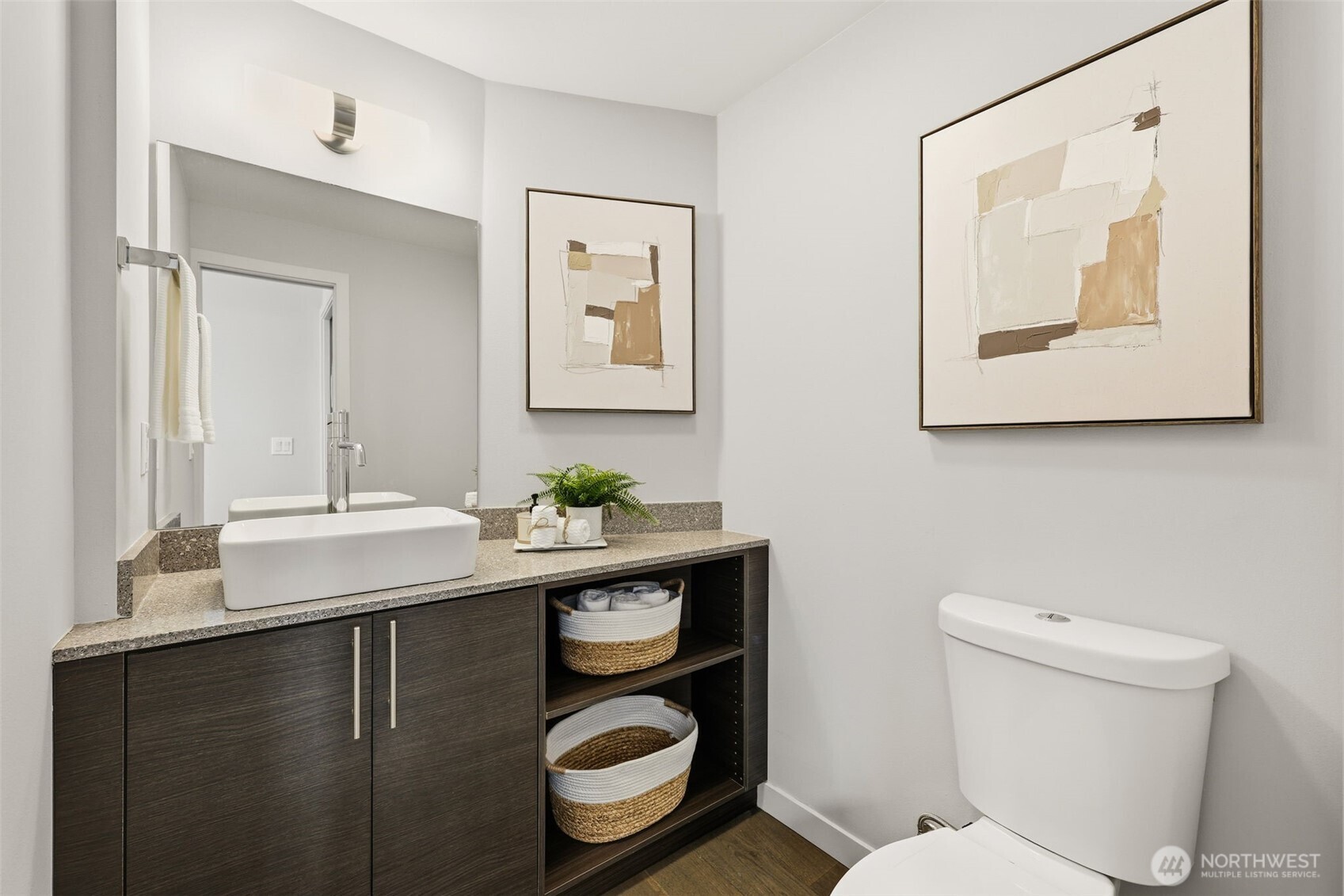 3010 63rd Avenue Southwest, Unit A Seattle, WA 98116 - Photo 15 of 38 a bathroom with a toilet a sink and mirror