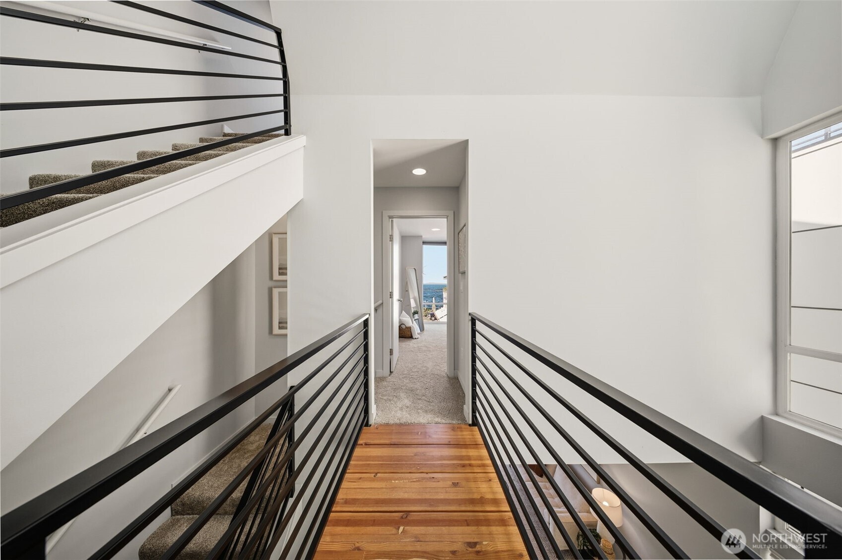 3010 63rd Avenue Southwest, Unit A Seattle, WA 98116 - Photo 16 of 38 a view of a hallway with wooden floor and staircase