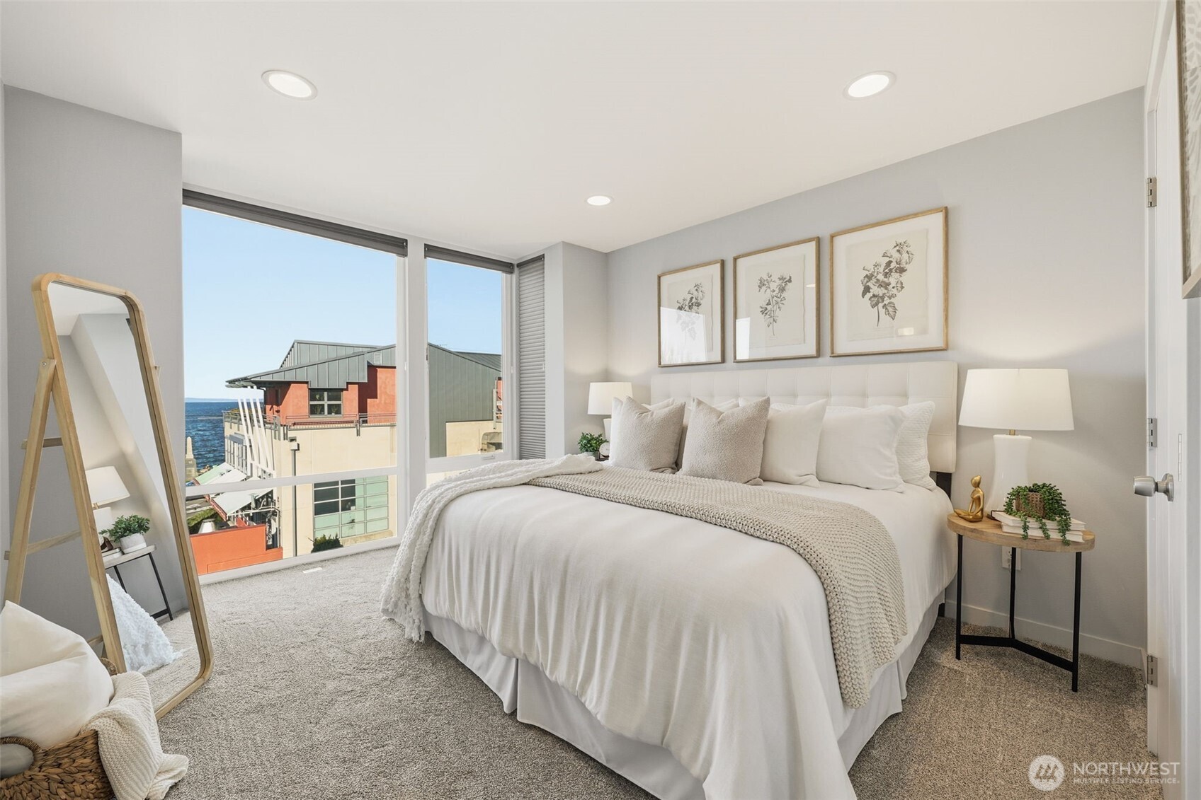 3010 63rd Avenue Southwest, Unit A Seattle, WA 98116 - Photo 17 of 38 a bedroom with a bed and a large window