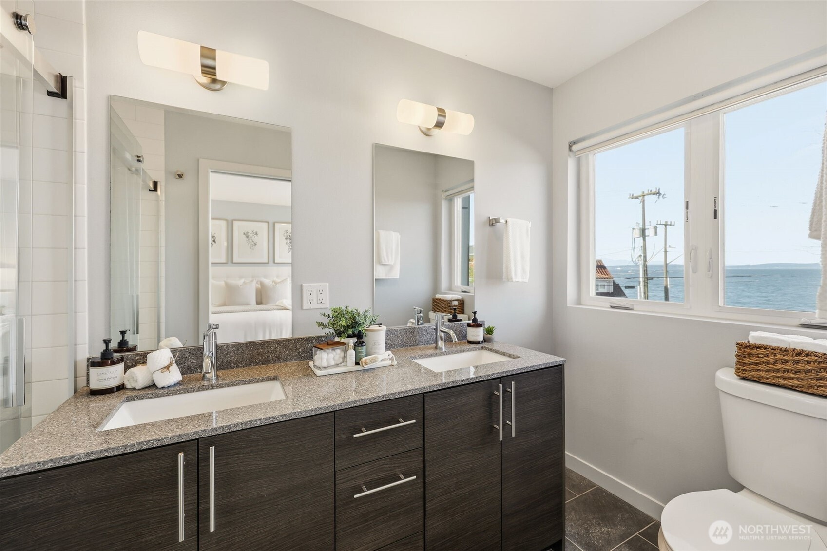 3010 63rd Avenue Southwest, Unit A Seattle, WA 98116 - Photo 21 of 38 a bathroom with a granite countertop sink toilet and mirror