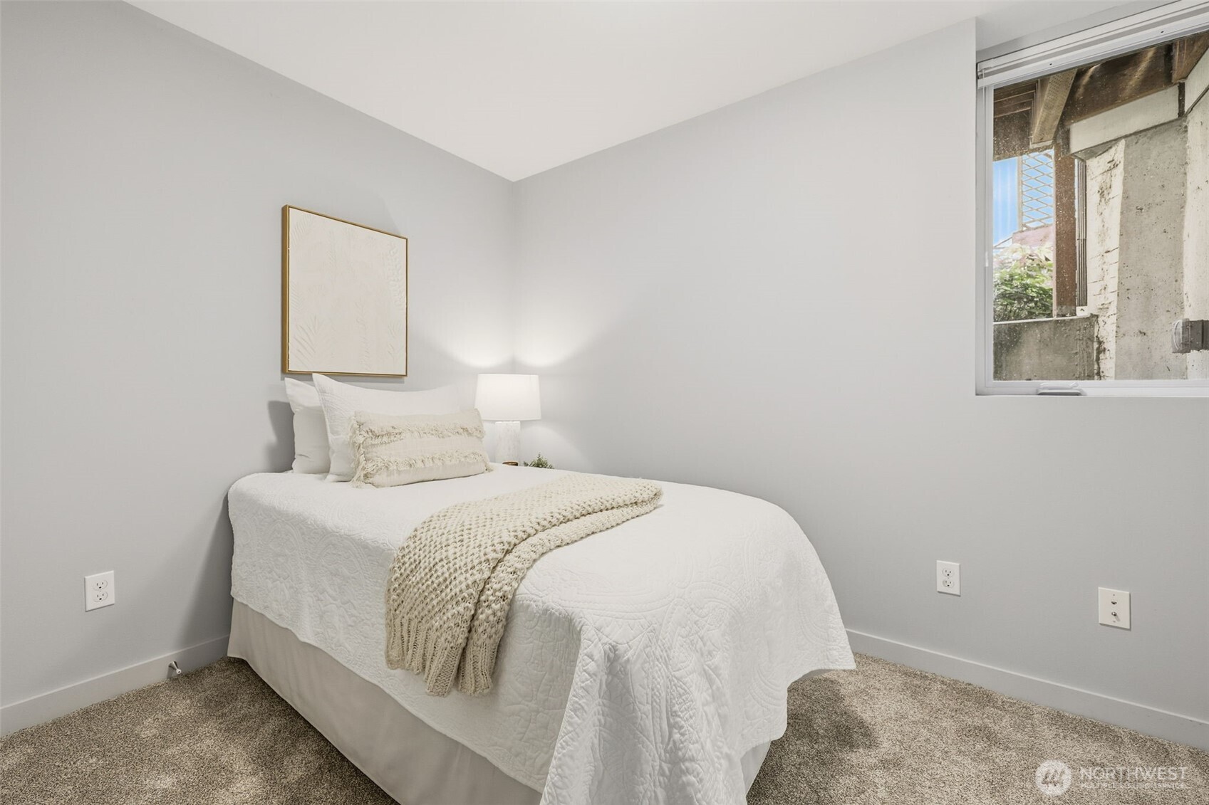 3010 63rd Avenue Southwest, Unit A Seattle, WA 98116 - Photo 27 of 38 a bedroom with a bed and a window