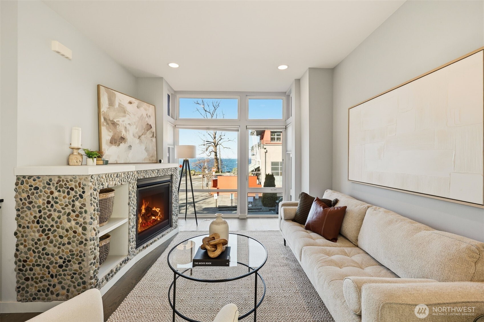 3010 63rd Avenue Southwest, Unit A Seattle, WA 98116 - Photo 5 of 38 a living room with furniture and a fireplace