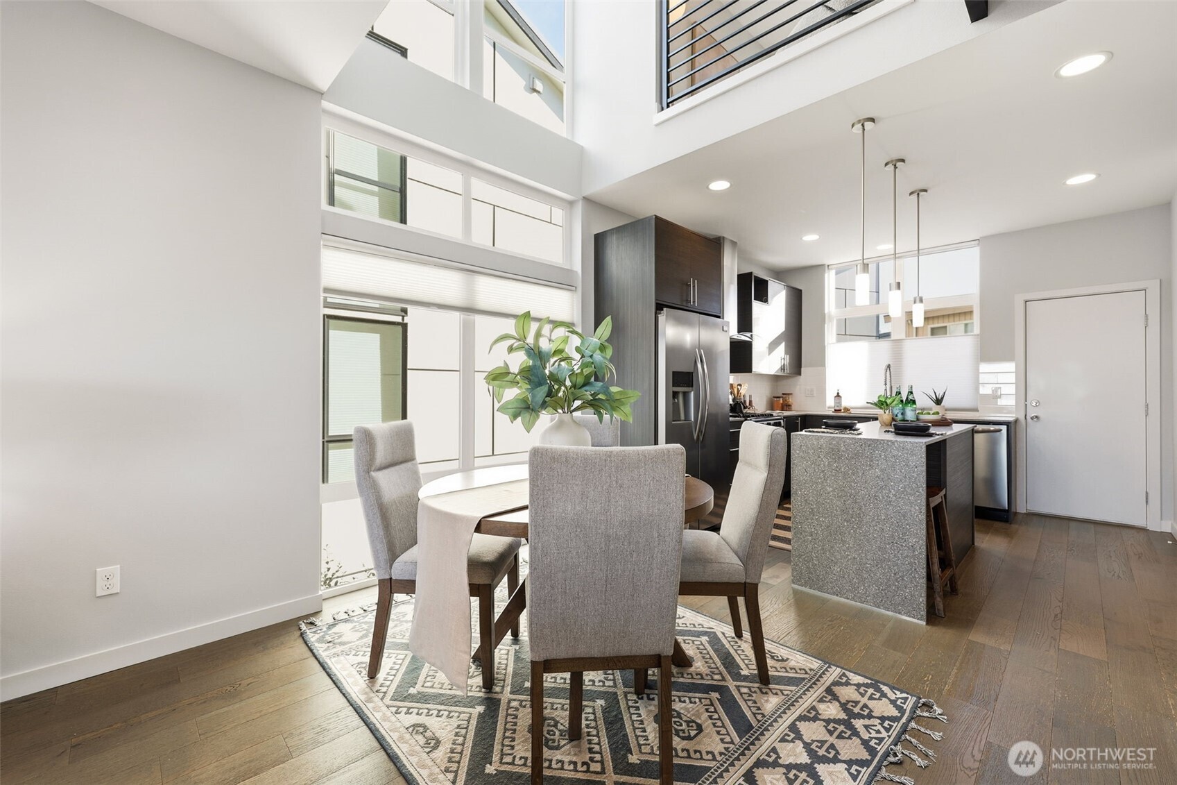 3010 63rd Avenue Southwest, Unit A Seattle, WA 98116 - Photo 9 of 38 a view of a dining room with furniture and a chandelier