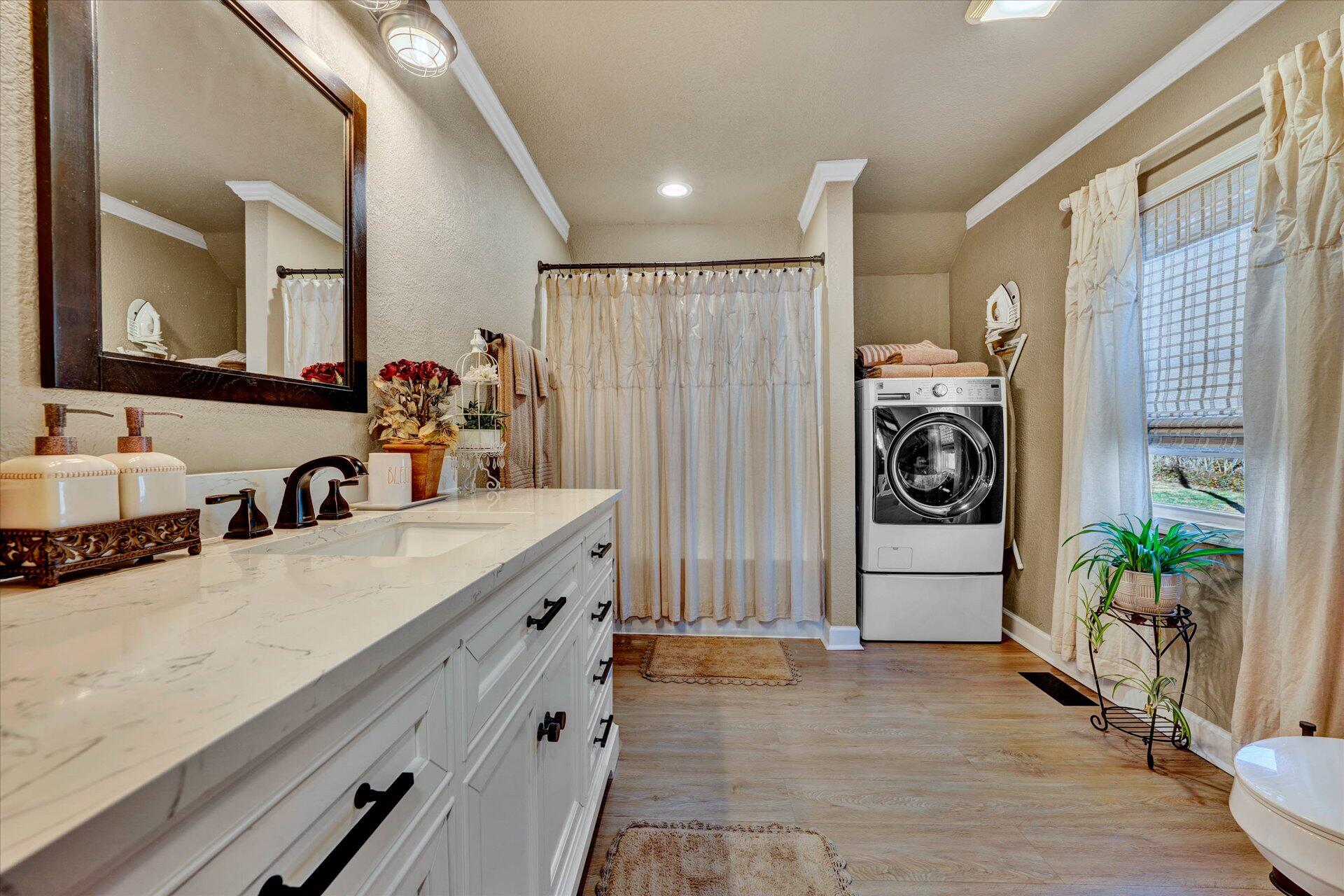110 Nursery Road Boones Mill, VA 24065 - Photo 12 of 33 a bathroom with a sink a mirror and a shower