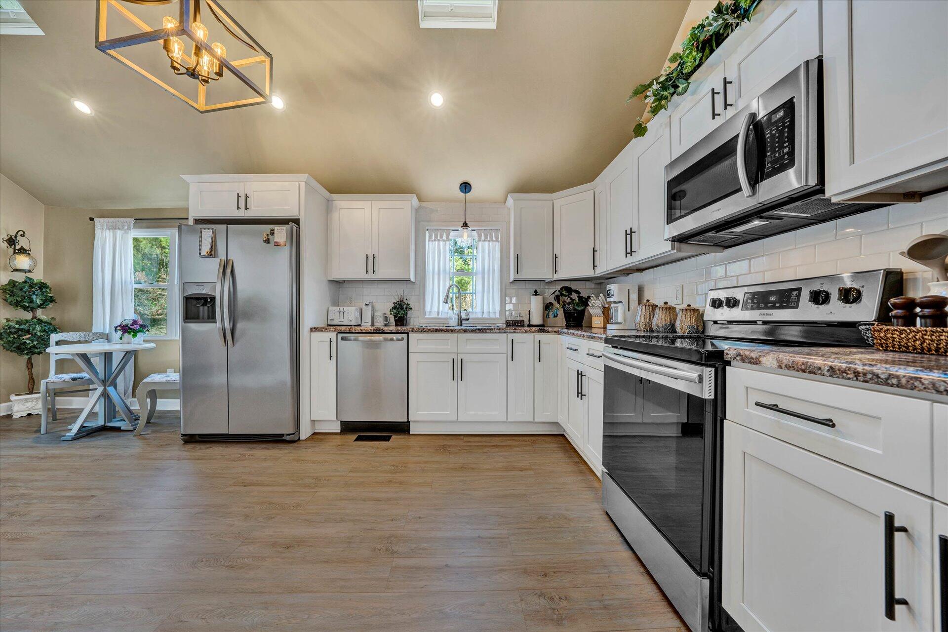 110 Nursery Road Boones Mill, VA 24065 - Photo 14 of 33 a kitchen with stainless steel appliances granite countertop a refrigerator a stove and a sink