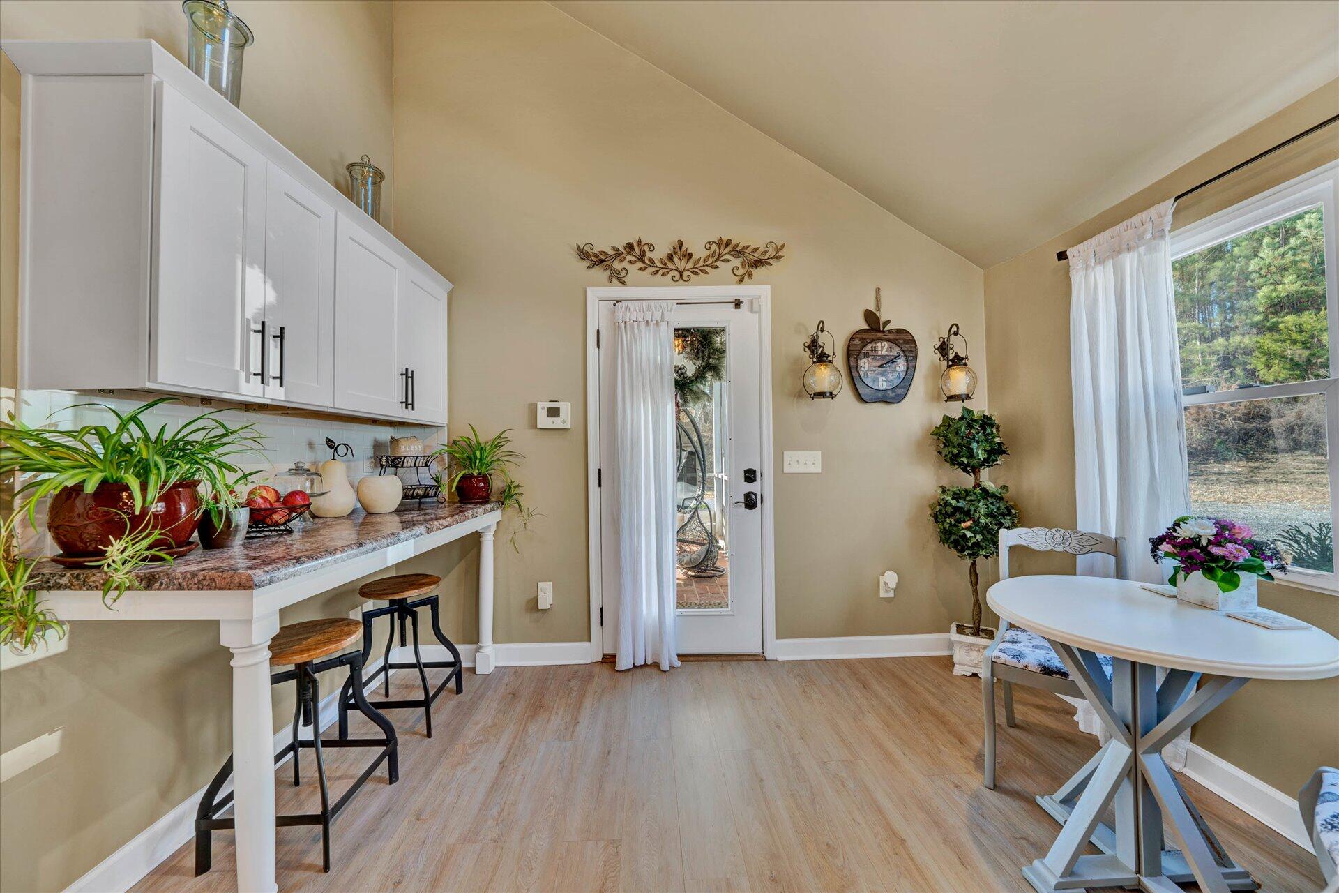 110 Nursery Road Boones Mill, VA 24065 - Photo 19 of 33 a view of a dining room with furniture and wooden floor