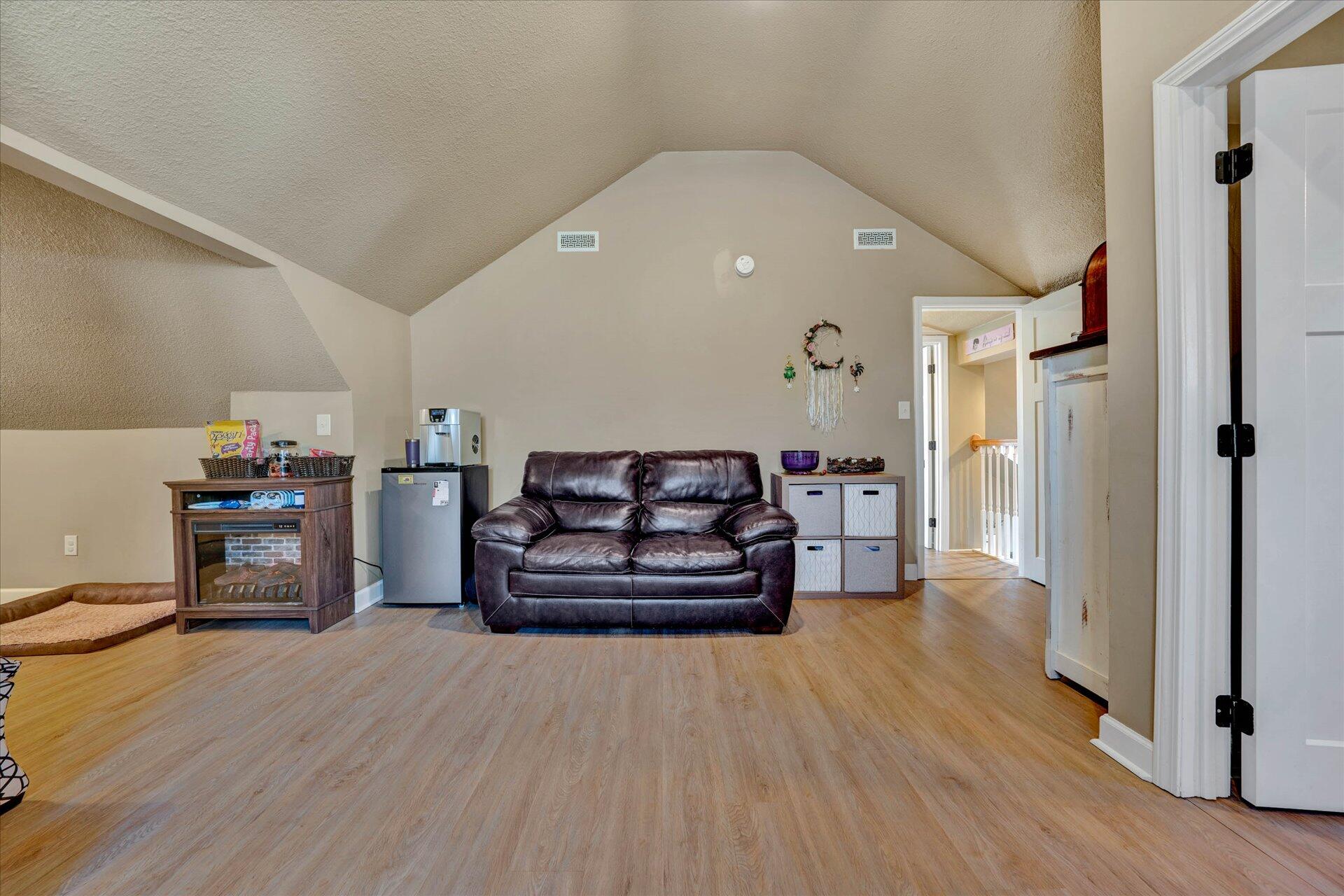 110 Nursery Road Boones Mill, VA 24065 - Photo 25 of 33 a spacious bedroom with a bed and a chair