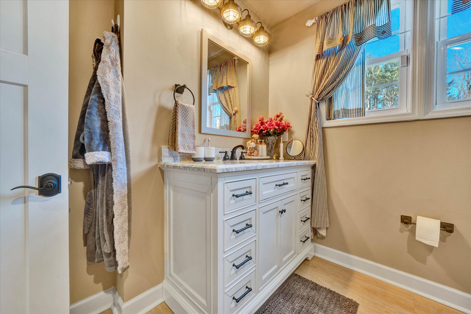 110 Nursery Road Boones Mill, VA 24065 - Photo 29 of 33 a bathroom with a sink and a mirror