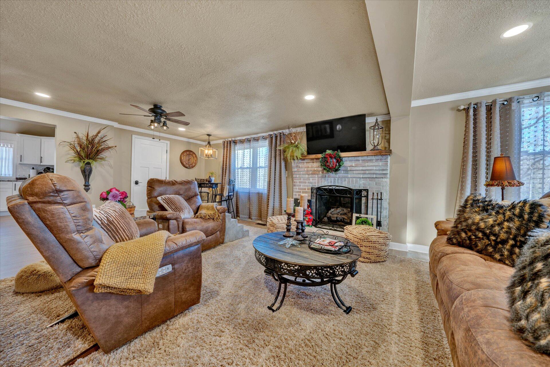 110 Nursery Road Boones Mill, VA 24065 - Photo 7 of 33 a living room with furniture fireplace and a flat screen tv