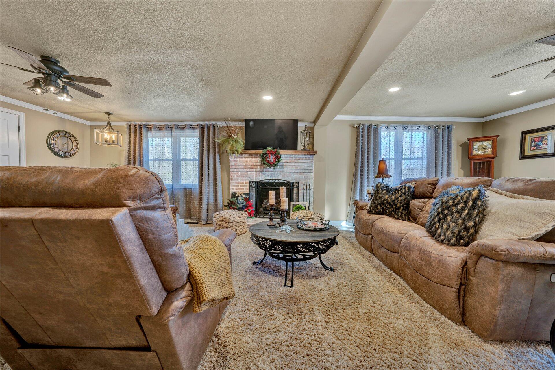 110 Nursery Road Boones Mill, VA 24065 - Photo 8 of 33 a living room with furniture and a fireplace