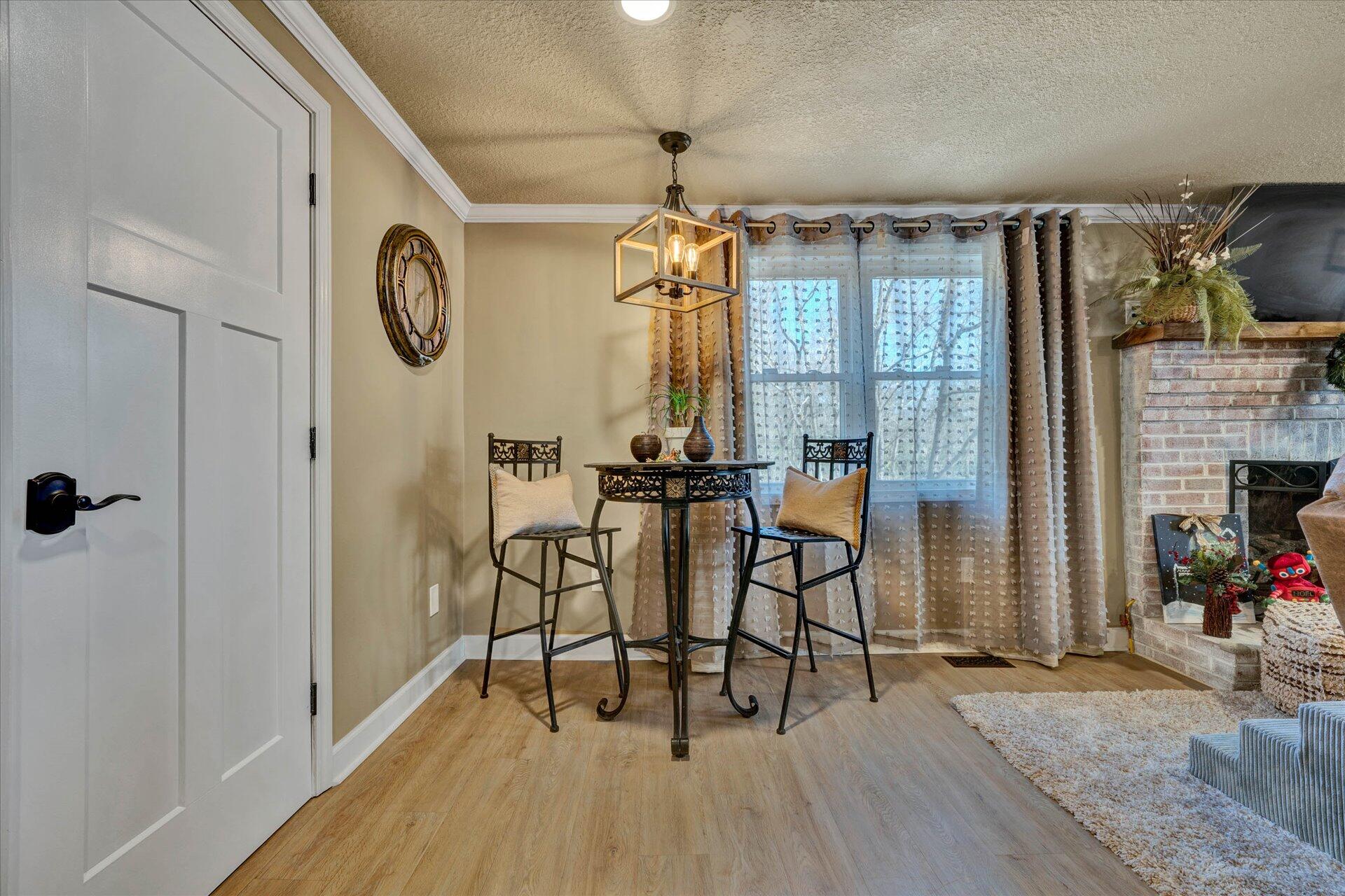 110 Nursery Road Boones Mill, VA 24065 - Photo 9 of 33 a view of a dining room with furniture window and wooden floor