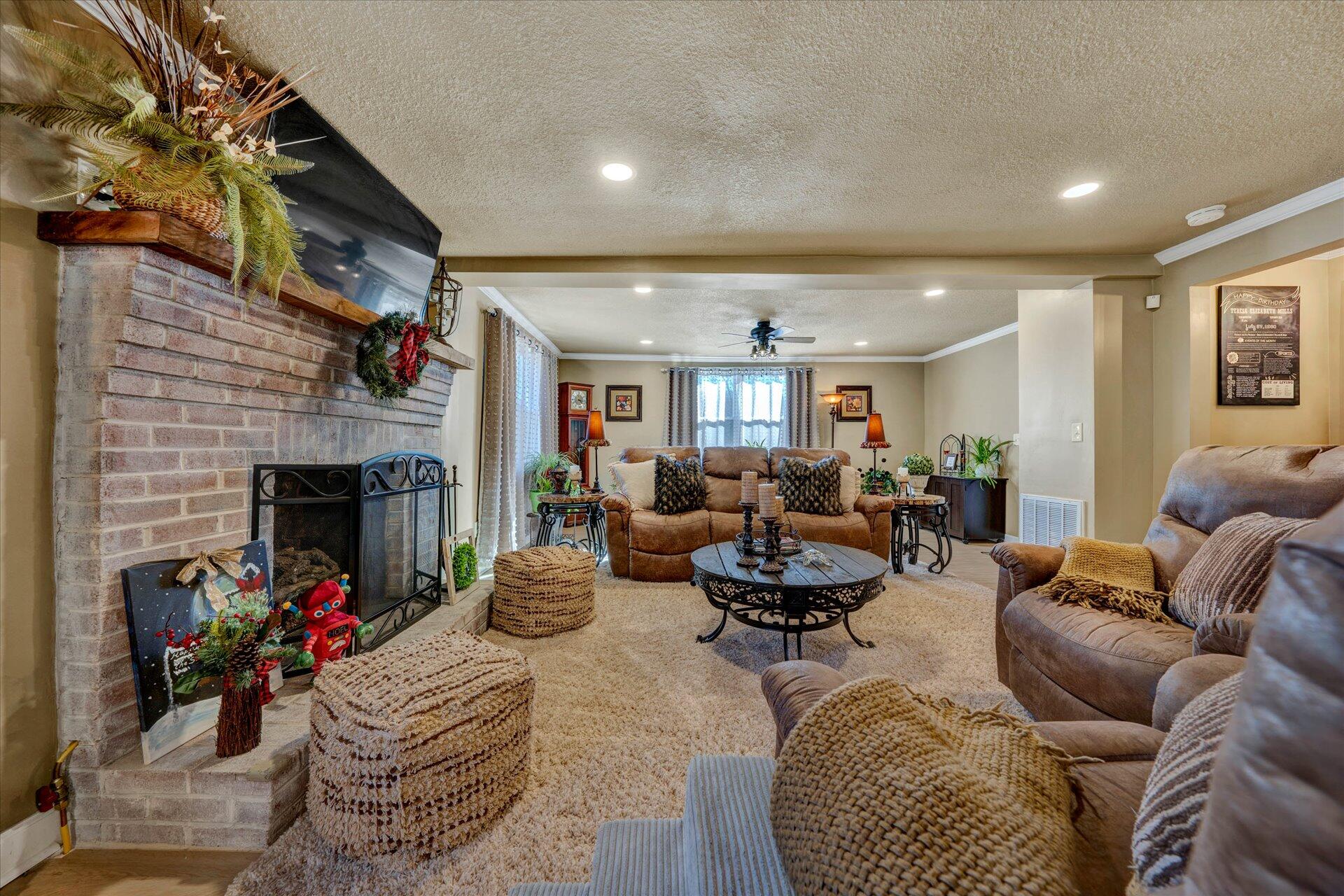 110 Nursery Road Boones Mill, VA 24065 - Photo 10 of 33 a living room with furniture wooden floor and a fireplace