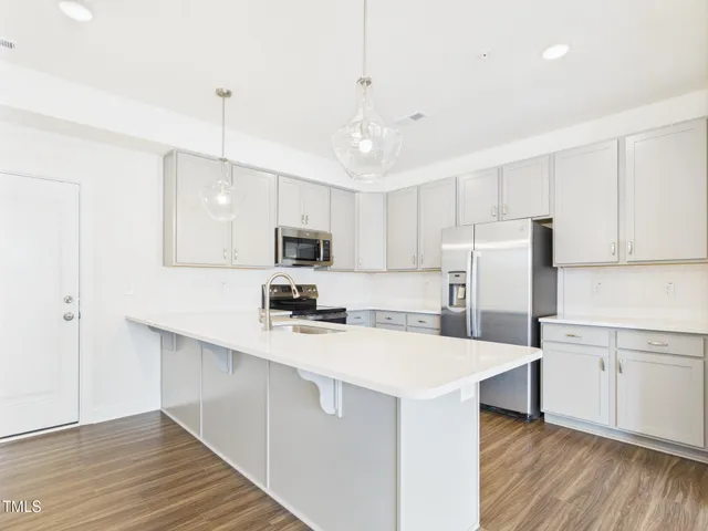 a kitchen with a sink and window