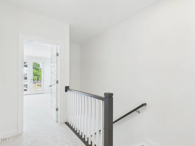 a view of an empty room with closet