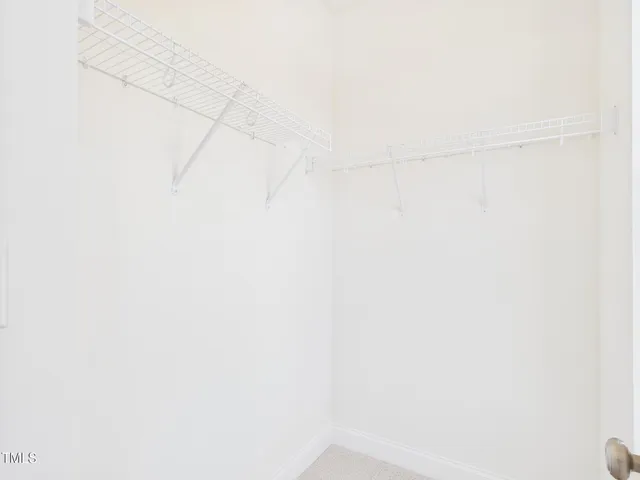 a bathroom with a double vanity sink and mirror