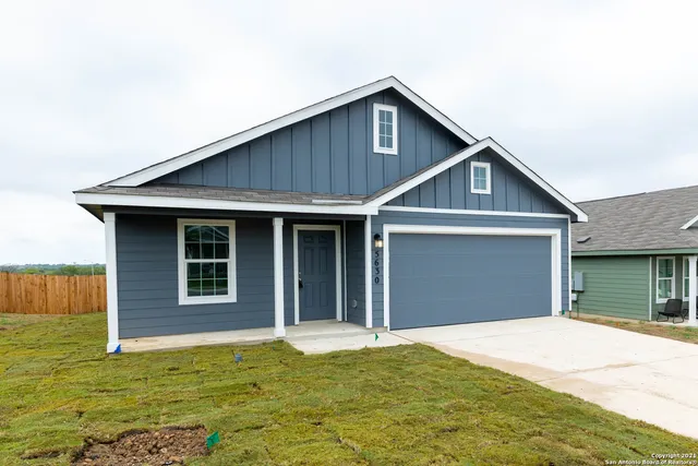 a house with yard in front of it