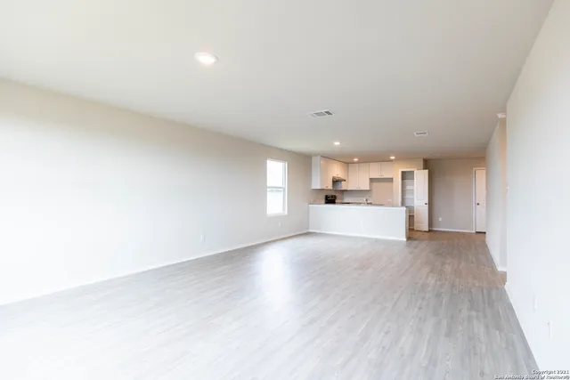 a view of a livingroom with wooden floor