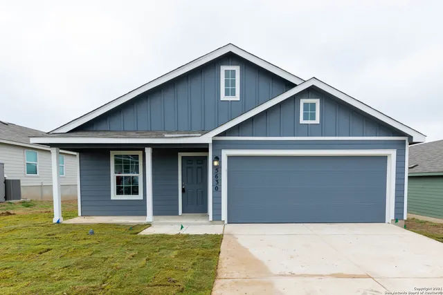 a front view of a house with yard