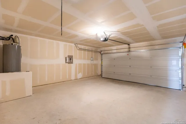 a view of an empty room with a garage
