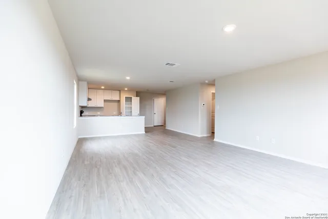 a view of a kitchen with wooden floor
