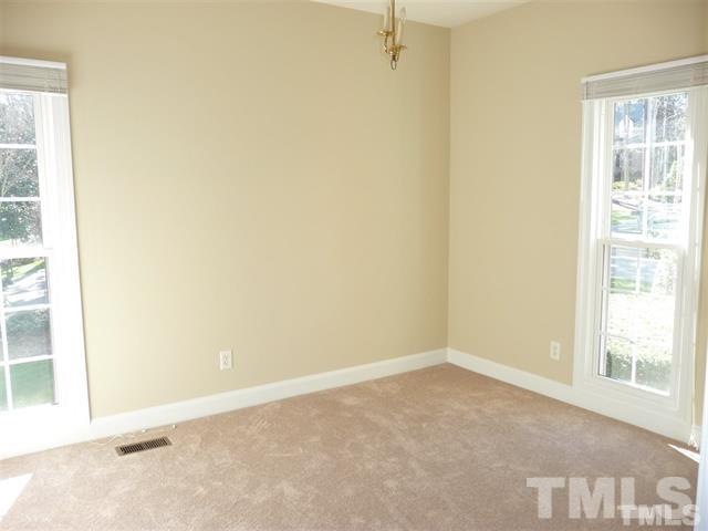 6908 Valley Ridge Court Raleigh, NC 27615 - Photo 22 of 25 an empty room with a window