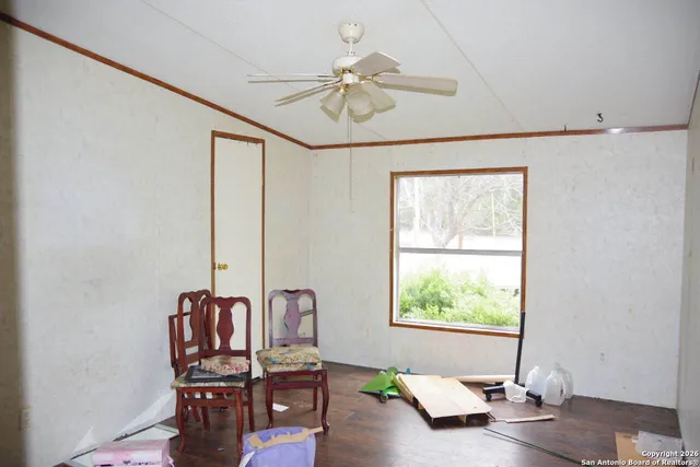 a view of a livingroom with furniture and window