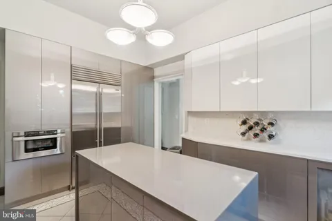 a kitchen with a refrigerator and countertop