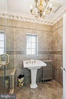 a bathroom with a sink a toilet and a shower