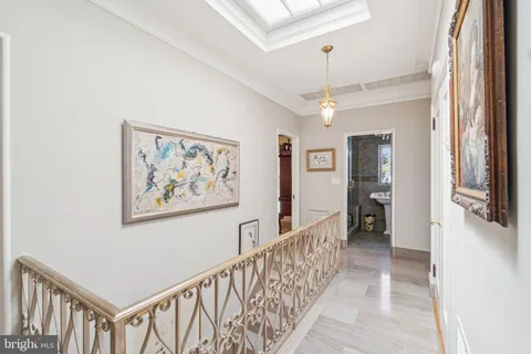 a view of a hallway with a chandelier