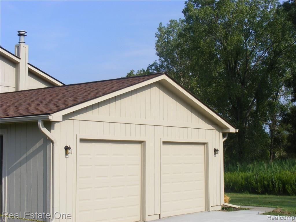3930 West Maple Road Wixom, MI 48393 - Photo 5 of 23 Spacious Garage