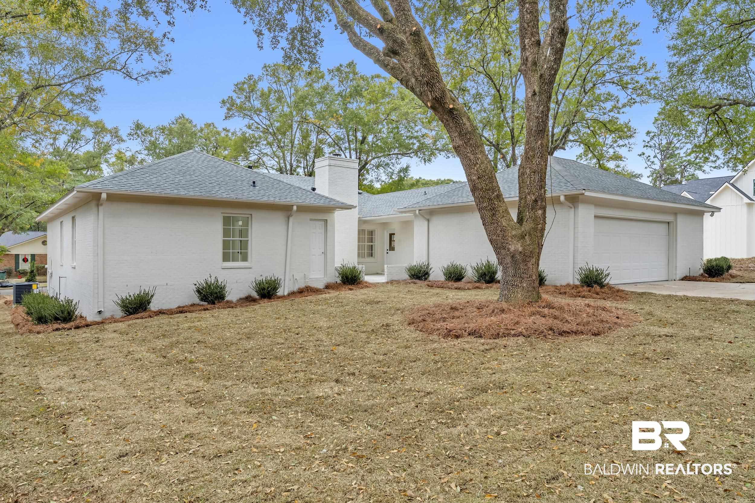 4924 Brooke Court Mobile, AL 36618 - Photo 33 of 34 Single story home featuring a chimney, a front yard, concrete driveway, and an attached garage