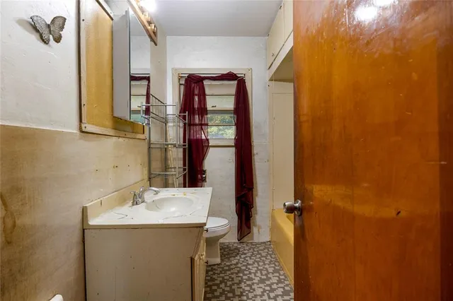 a bathroom with a sink and mirror