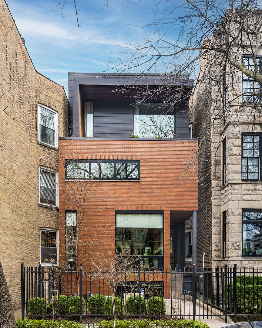 2249 North Burling Street Chicago, IL 60614 - Photo 1 of 41 a front view of a building with glass windows