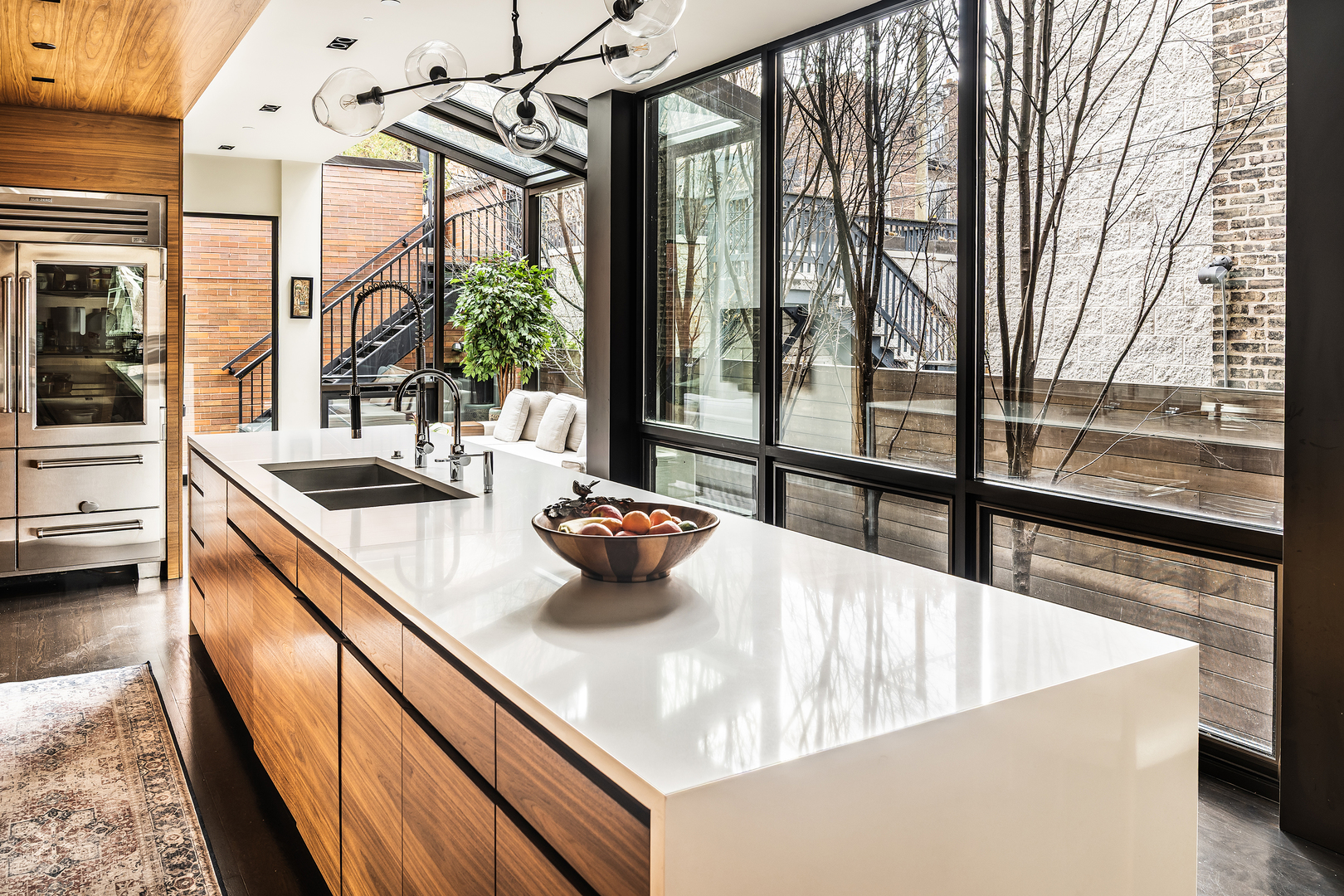 2249 North Burling Street Chicago, IL 60614 - Photo 17 of 41 a kitchen with a sink and large windows