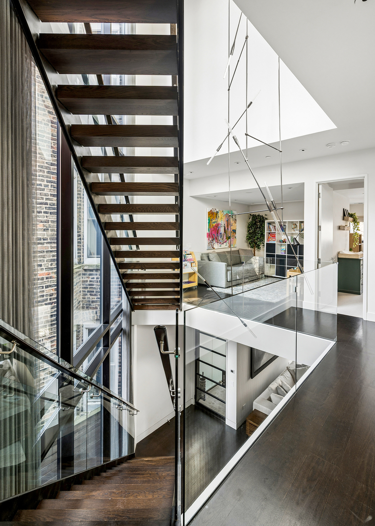 2249 North Burling Street Chicago, IL 60614 - Photo 23 of 41 an entryway with wooden floor and staircase
