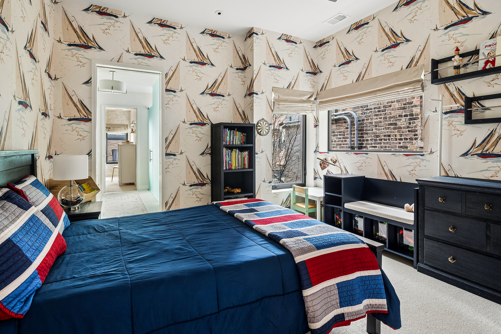 2249 North Burling Street Chicago, IL 60614 - Photo 25 of 41 a bedroom with a bed and a chandelier