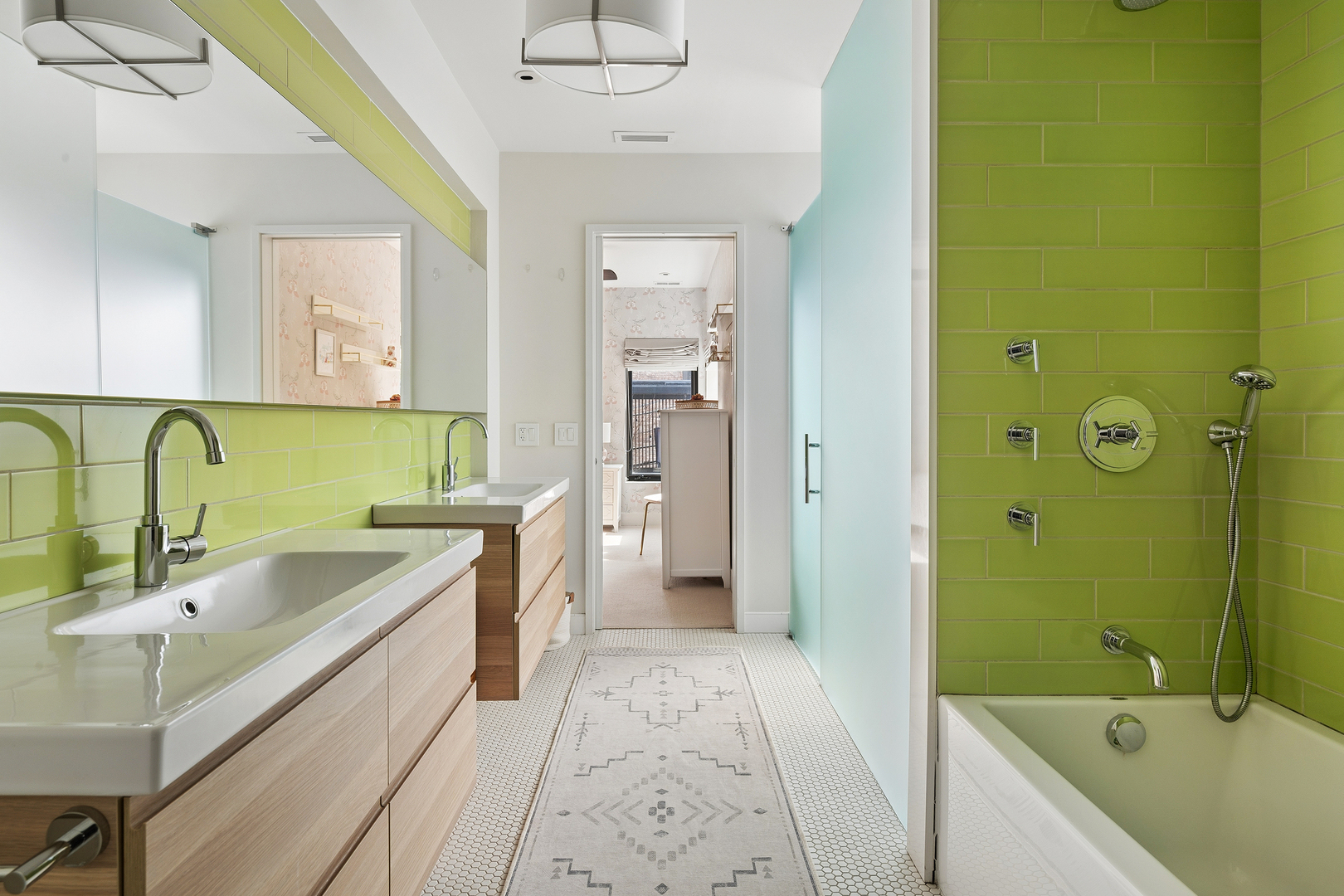 2249 North Burling Street Chicago, IL 60614 - Photo 26 of 41 a bathroom with a tub sink and mirror