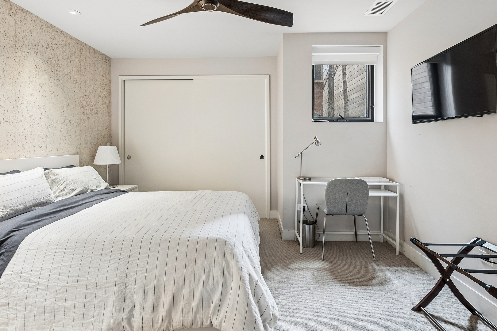 2249 North Burling Street Chicago, IL 60614 - Photo 39 of 41 a bedroom with a bed and a chair