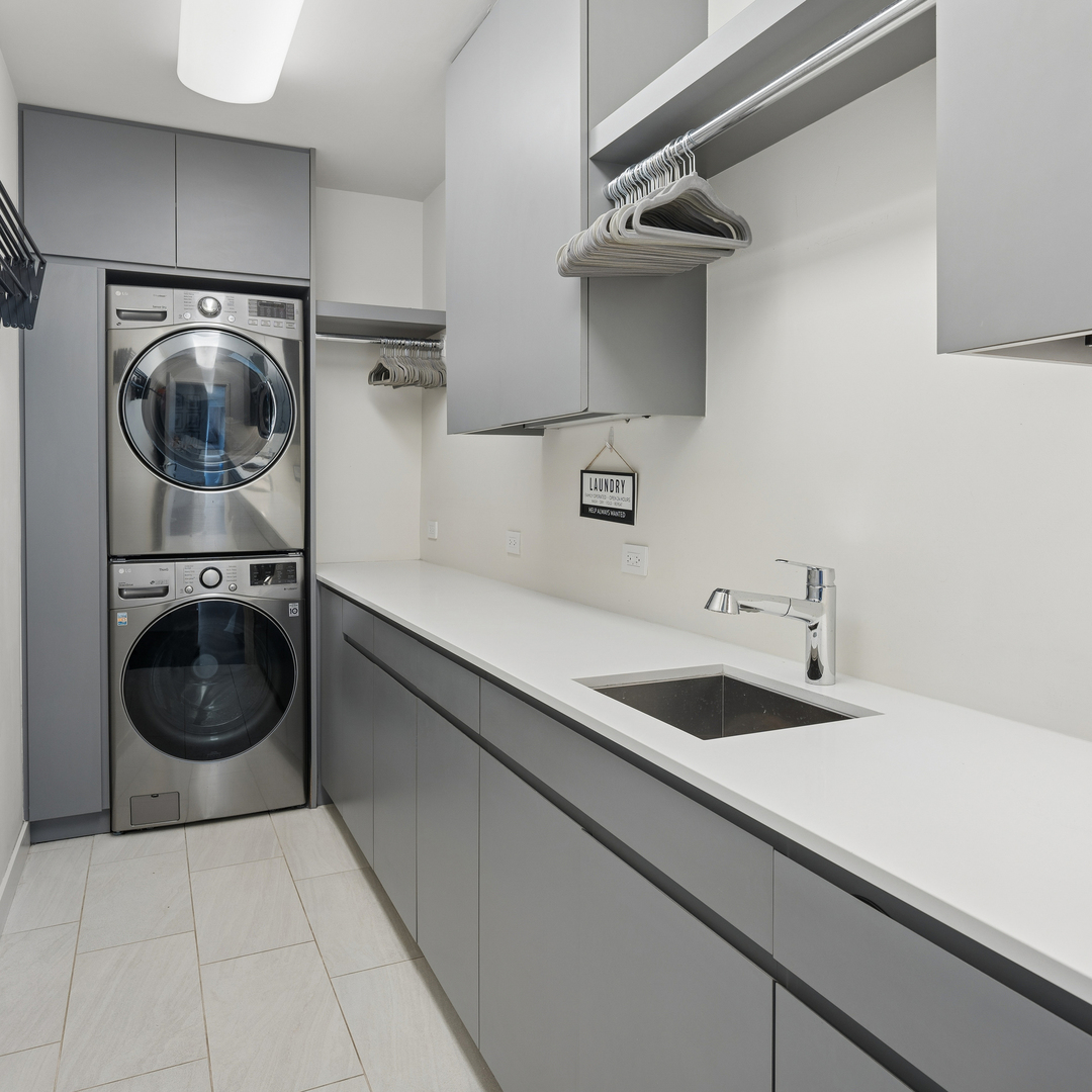 2249 North Burling Street Chicago, IL 60614 - Photo 41 of 41 a utility room with sink dryer and washer
