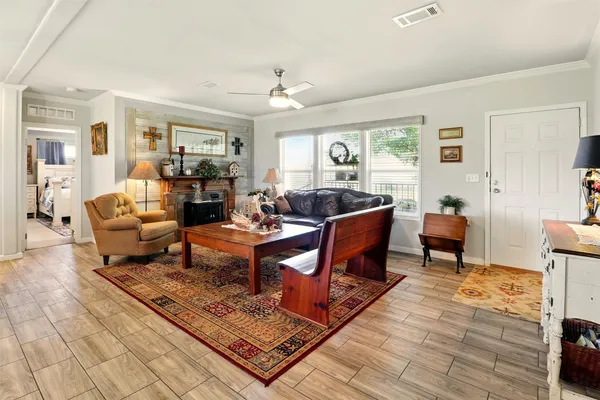 a living room with furniture rug and window