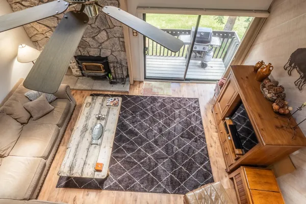 a view of living room with furniture and a fireplace