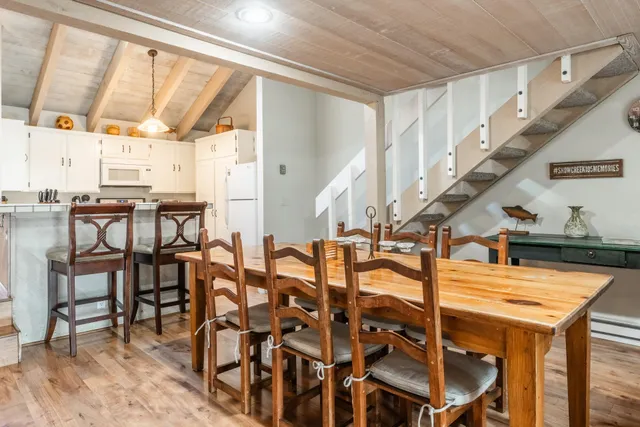 a view of a dining room with furniture and a window