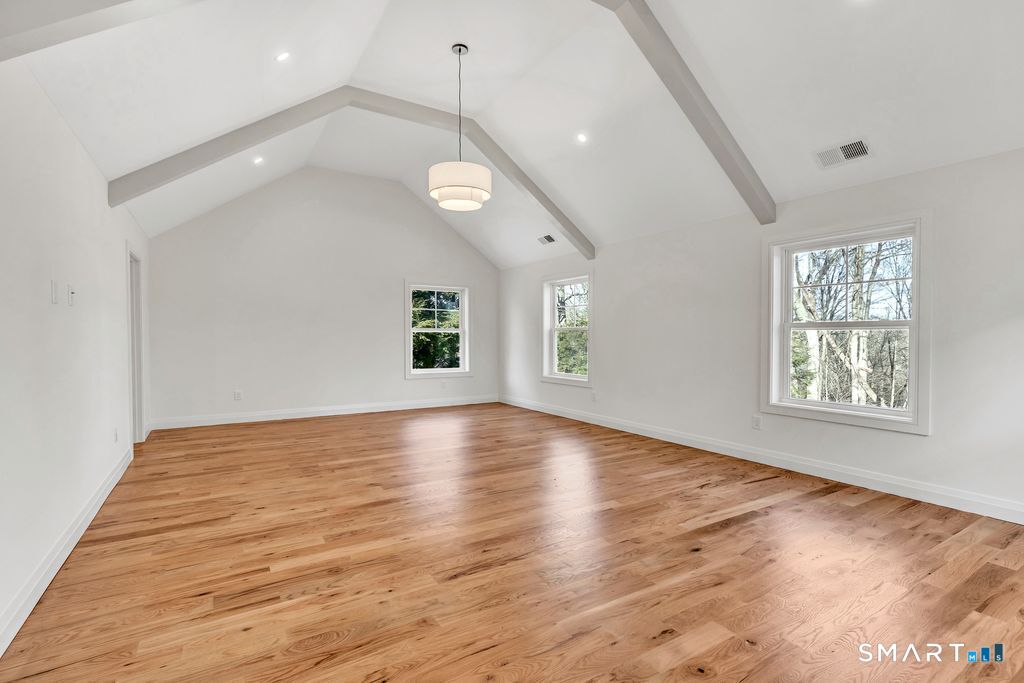 100 Tashua Road Trumbull, CT 06611 - Photo 12 of 26 an empty room with wooden floor and windows