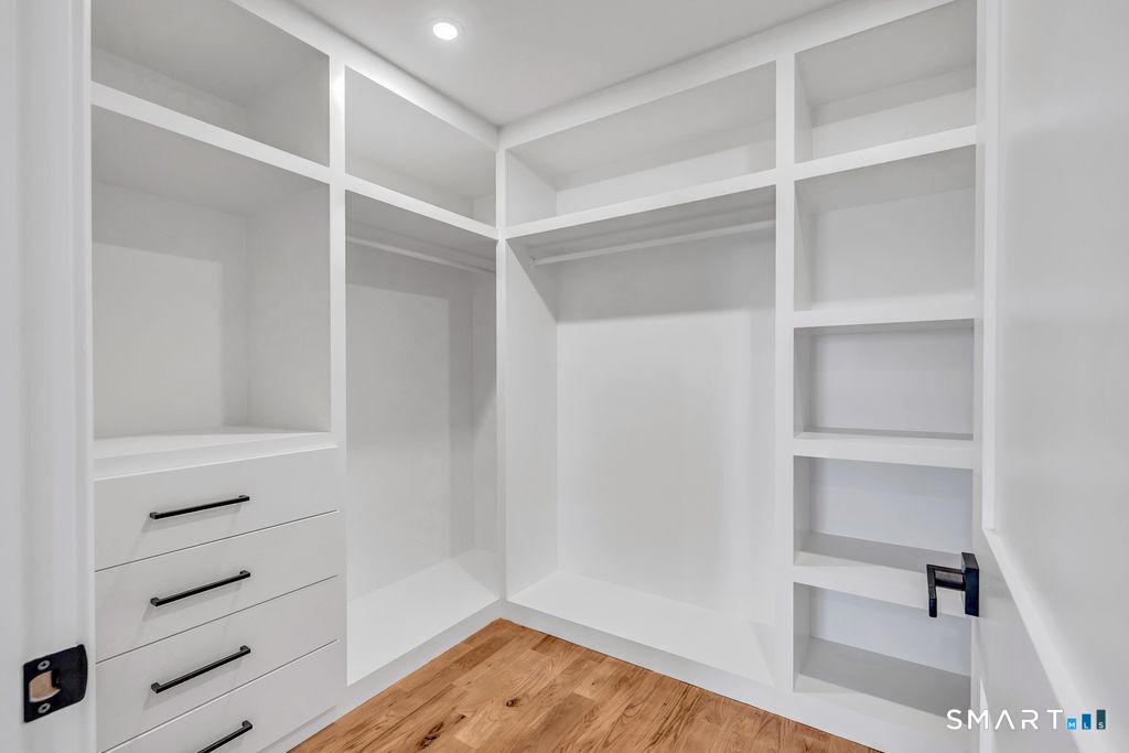 100 Tashua Road Trumbull, CT 06611 - Photo 13 of 26 a view of walk in closet with empty racks