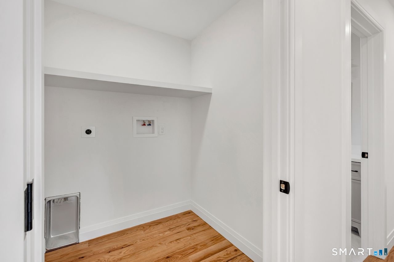 100 Tashua Road Trumbull, CT 06611 - Photo 17 of 26 a view of a hallway with wooden floor