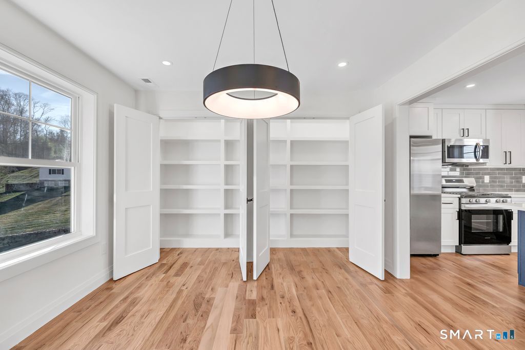 100 Tashua Road Trumbull, CT 06611 - Photo 18 of 26 a view of a kitchen with a sink and a stove top oven
